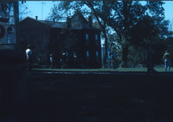 Cast and crew playing frisbee